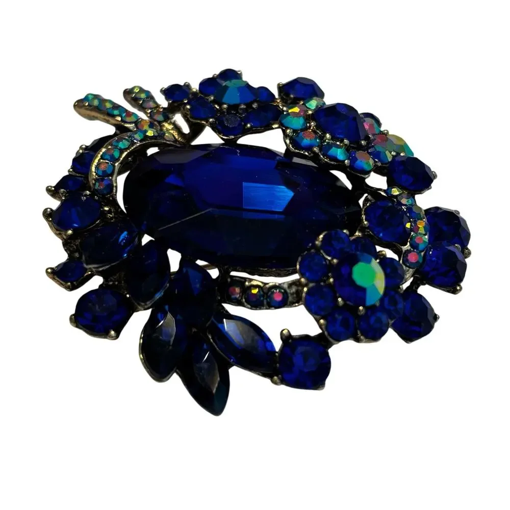 Vintage inspired chunky blue rhinestones brooch ornate silvertone AB finish